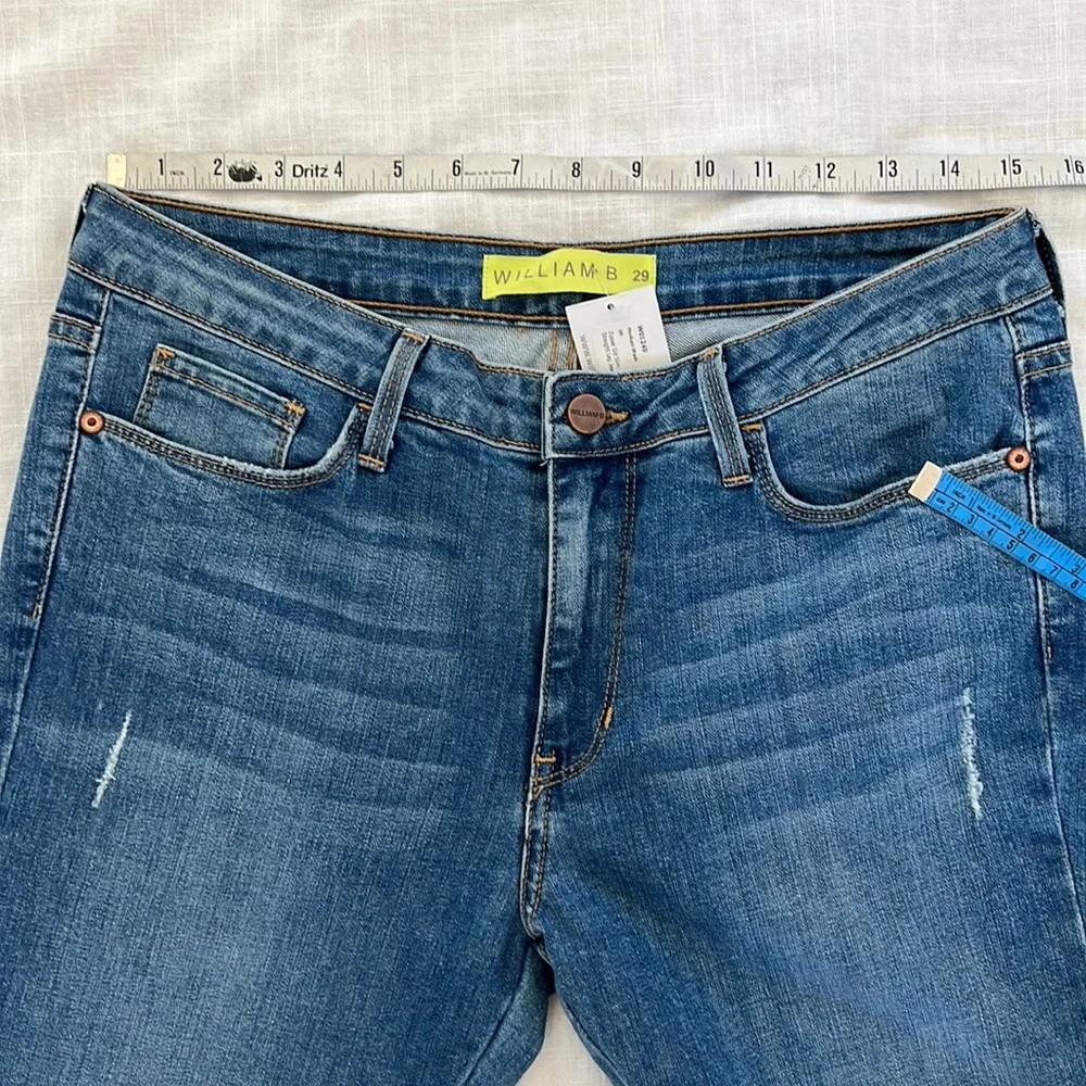 William B size 29 medium wash zipper slit slim straight leg jean. New with tag